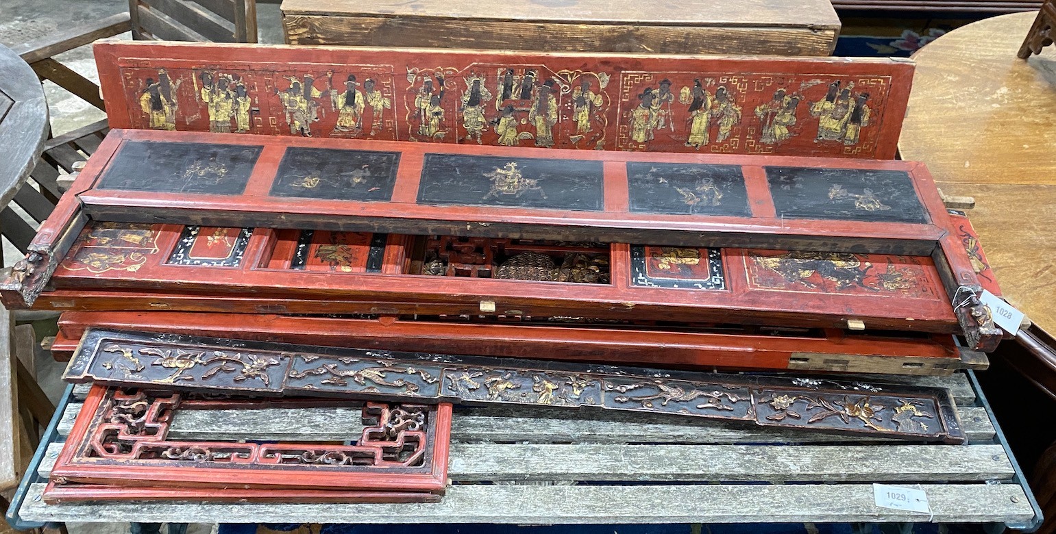 Nine sections of a Chinese red lacquered cabinet, with gilt figural decoration